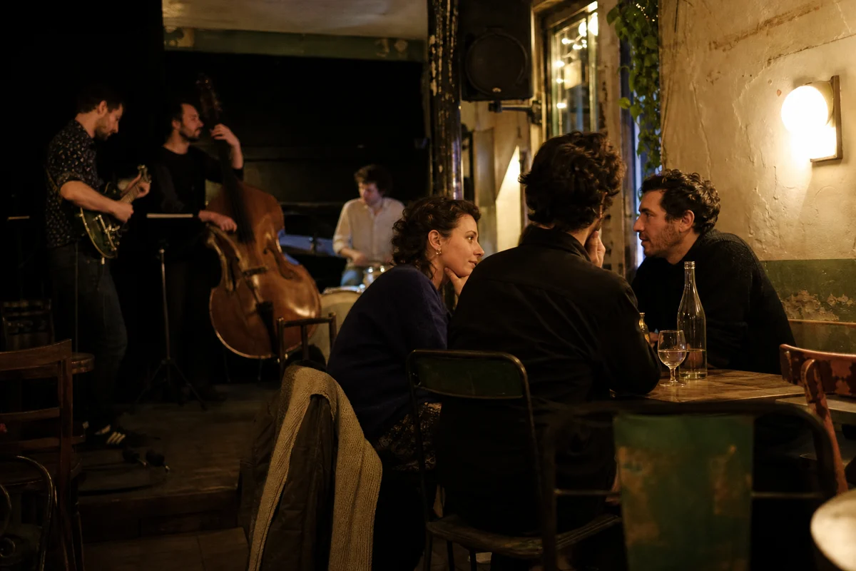 Friends enjoying a live band together in a welcoming neighborhood bar